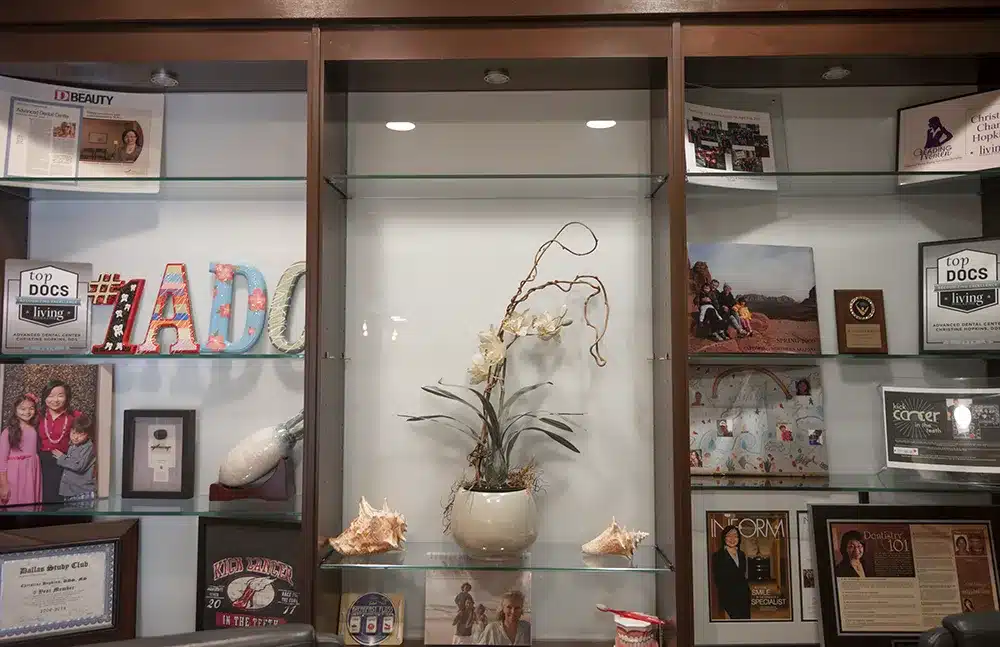 Cabinet with pictures and decorations in our waiting room.